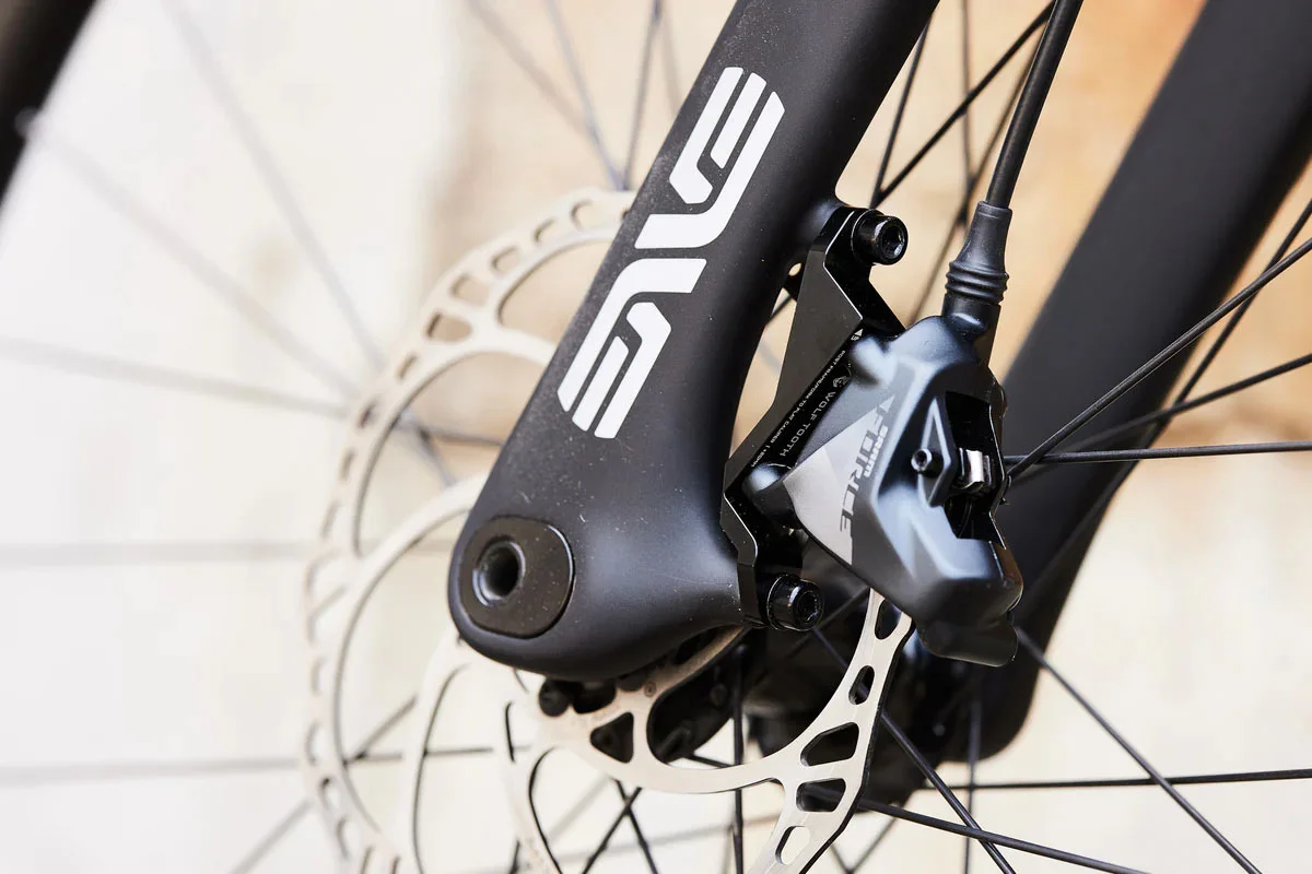 Wolf Tooth Post to Flat Mount adapter puts new brakes on old frames, forks