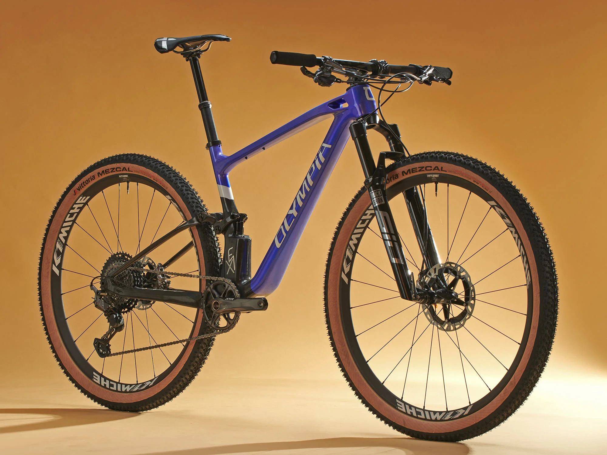 Olympia F1-X Hides a Rear Shock Partially Inside its All-New Carbon XC MTB Frame